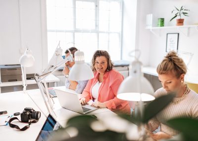 Entrepreneurs working in open plan office in Sweden.